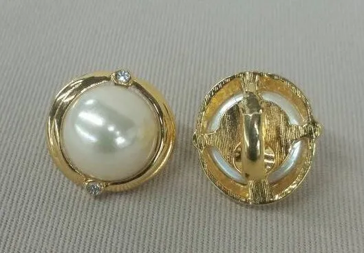 Faux pearl round clip on earrings with rhinestone accents